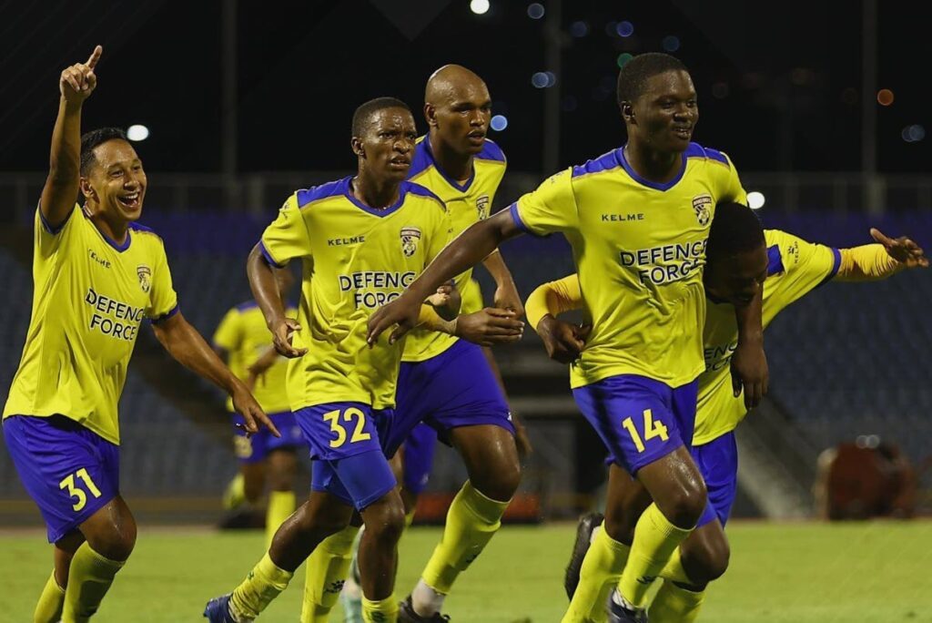 Defence Force players celebrate a goal during their 2-0 victory over AC PoS on April 3. - File photo courtesy TTPFL