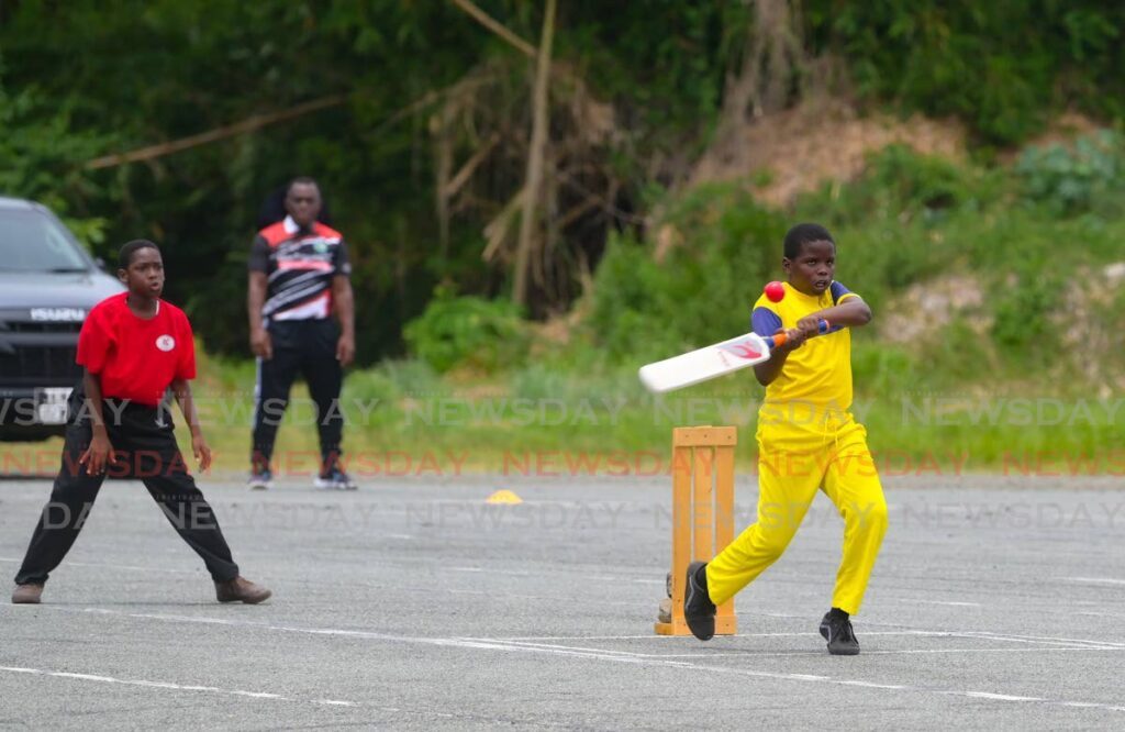 A Whim Anglican batsman looks to hit a rising delivery against Scarborough RC in the final of the Tobago Primary Schools Cricket League on Friday at Parade Grounds, Bacolet.  - Visuals Style 