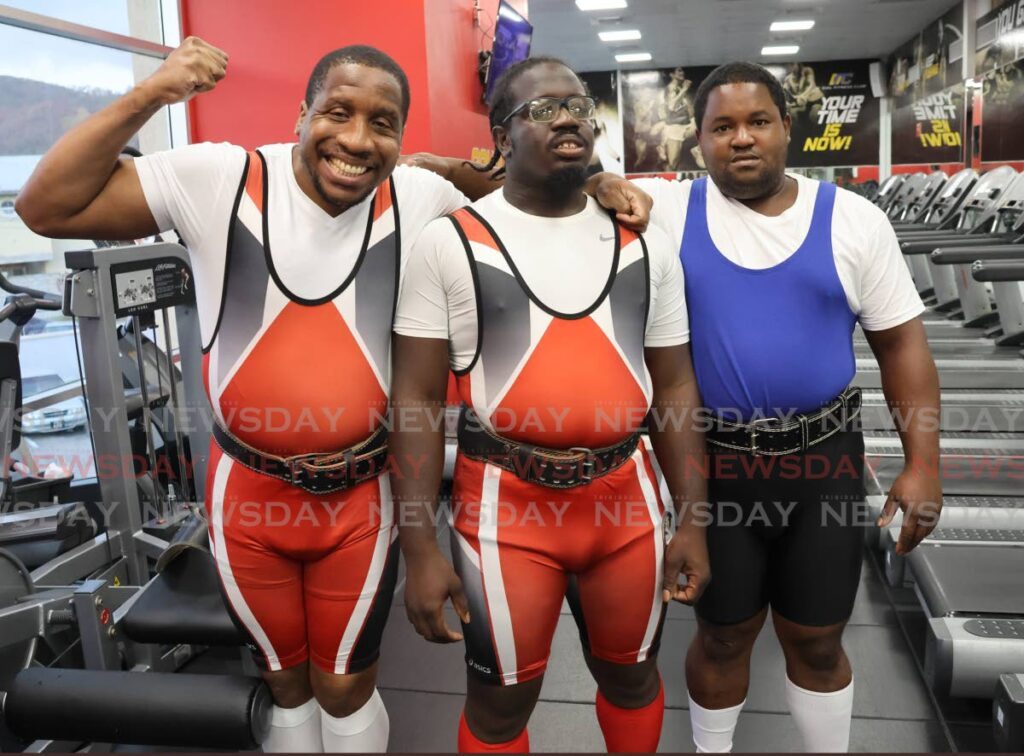 From left, Olympic medallist Damien Marquis and Kadeem Brown, alongside Carlos King, attend then Special Olympics of TT powerlifting event held at the D’Dial Fitness Gym in Long Circular Mall, St James on May 11. - Photo by Roger Jacob