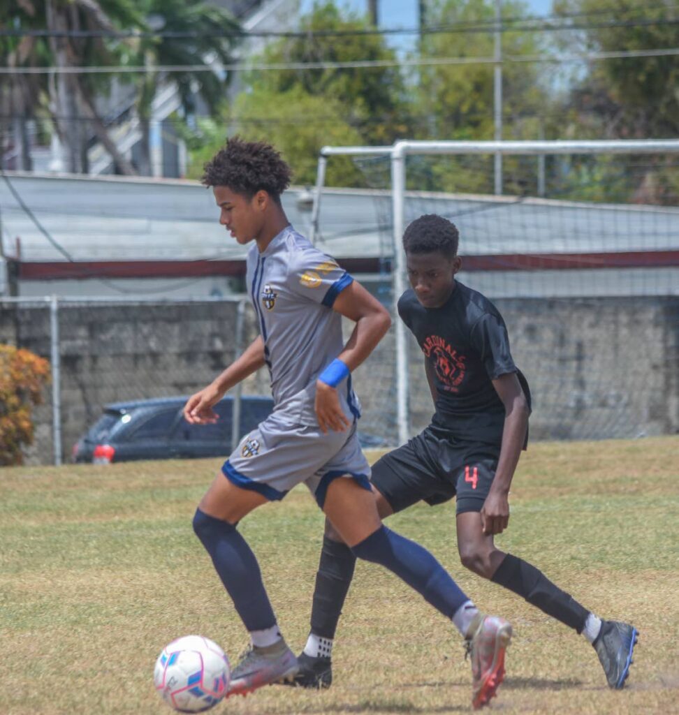 City FC forward Reagan Rowe (left) takes on a Cardinals FA opponent during their Republic Cup 2024 under-14 semifinal at the Hasely Crawford Stadium training field in Mucurapo on May 11. Photo courtesy Republic Cup.  - 