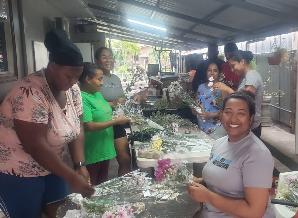 Members of the Mafeking Community Council prepare Mother’s Day bouquets to surprise mothers in the community on May 11.