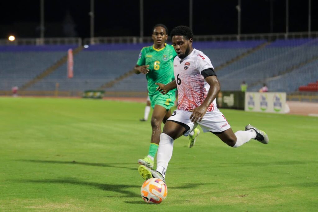 TT’s Andre Raymond looks to make a pass during the second friendly against Guyana, at the Hasely Crawford Stadium, Port of Spain on May 15. - Photo by Daniel Prentice