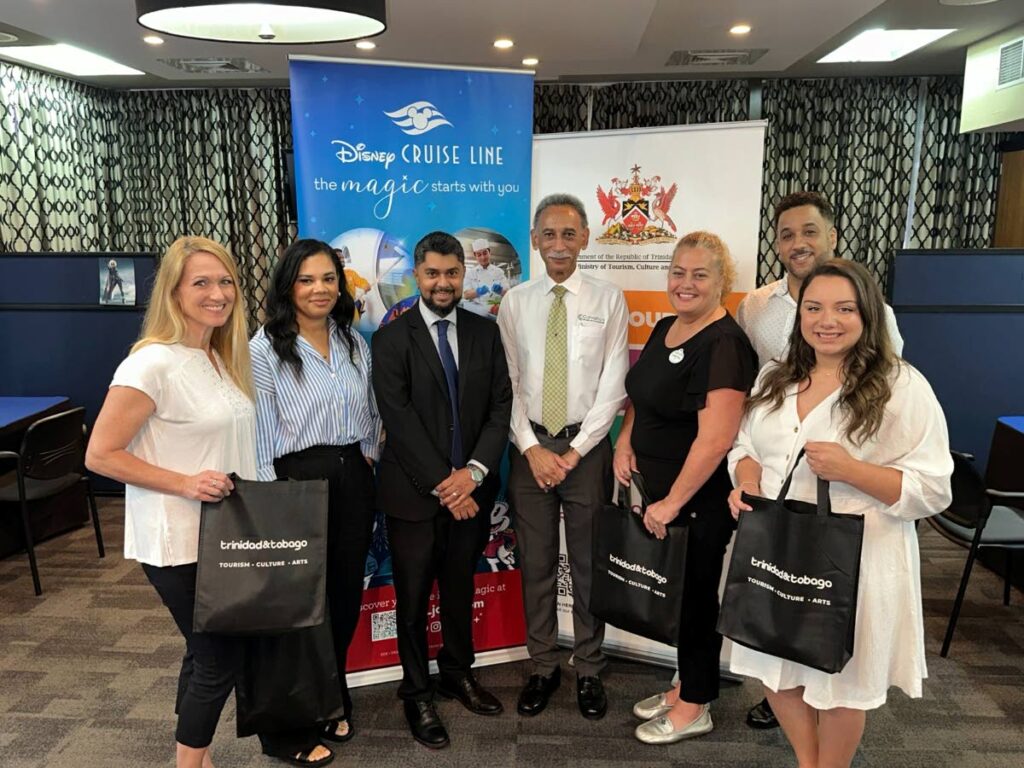 Acting Permanent Secretary in the Ministry of Tourism, Culture and the Arts Videsh Maharaj, third left, and Charles Carvalho, CEO of Meridian Recruitment Agency Ltd, centre, pose with the Disney Cruise Line recruiters at Queen’s Hall, St Ann's, last week. - Photo courtesy Ministry of Tourism, Culture and the Arts