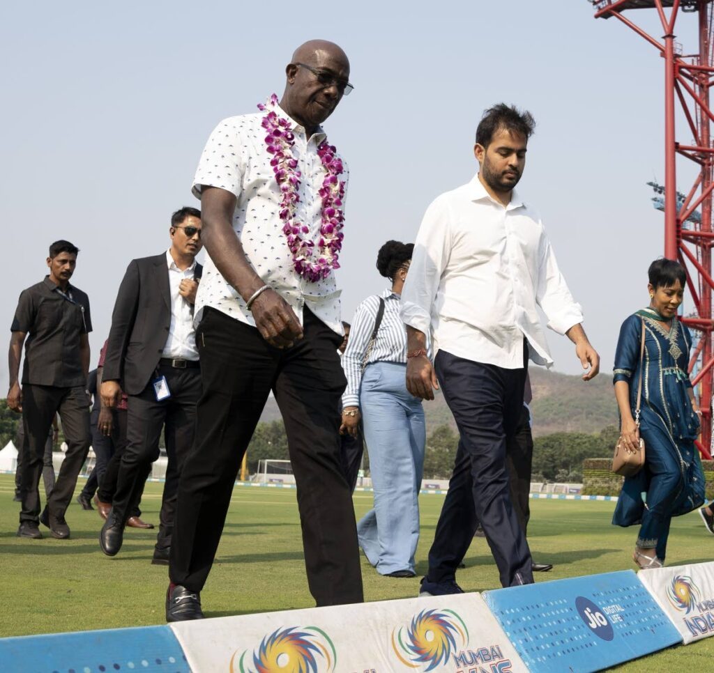 Prime Minister Dr Rowley, left, and his wife Sharon Rowley are escorted by Akash Ambani, chairman of Reliance Jio Ltd and owner of the Indian Premier League cricket team, the Mumbai Indians, during a tour toured of the Jio World Convention Centre and the Reliance Corporate Park in Mumbai, India, on May 17.  - Photo courtesy OPM