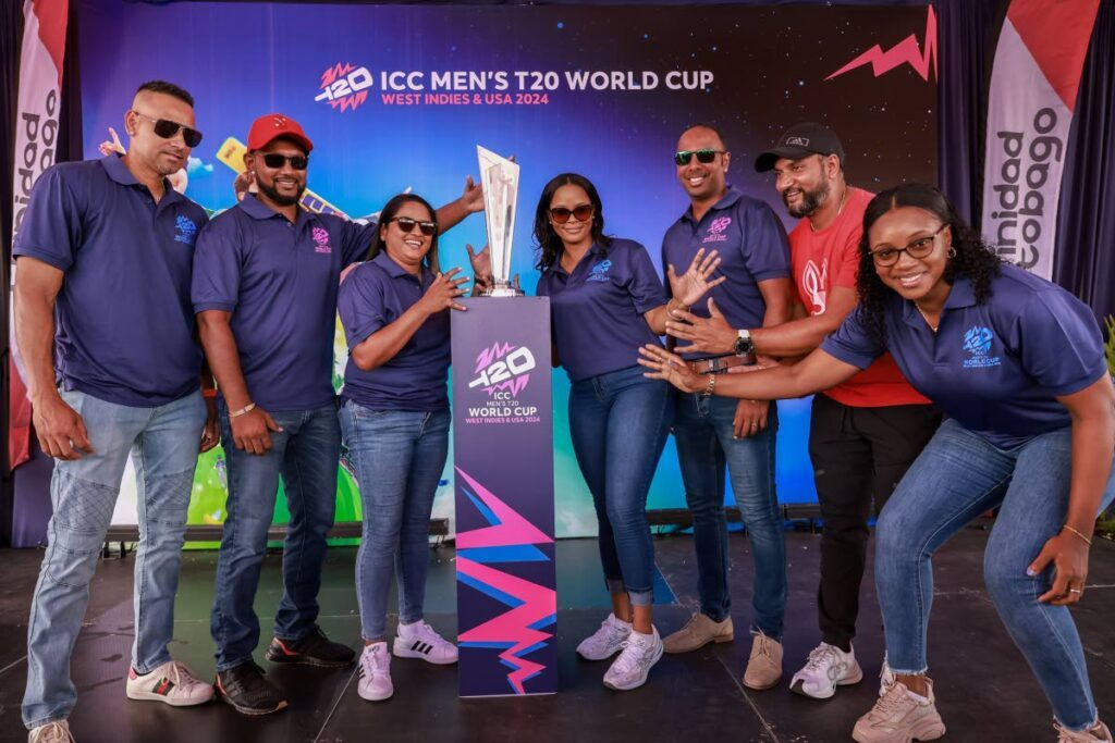 (L-R) Former West Indies cricketers Rayad Emrit, Denesh Ramdin Anisa Mohammed, Merissa Aguilleiram Samuel Badree, Ravi Rampaul and Stacy-Ann King pose for a photograph with the ICC T20 World Cup trophy during the TT-leg of the trophy tour for the June 1-29 tournament, on May 18 at the Brian Lara Cricket Academy, Tarouba. - Photo by Jeff K Mayers