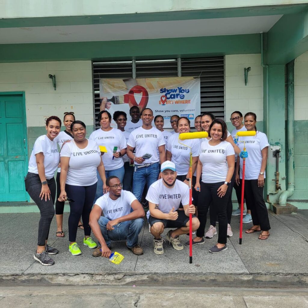 The CUNA Caribbean Insurance (CCI) team members gather after a productive day of repainting and renovations at Patna/River Estate Government Primary School on May 18. - Photos courtesy CCI