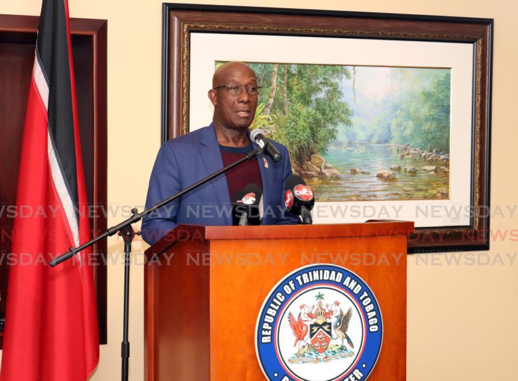 Prime Minister Dr Keith Rowley speaks to media at the VIP Lounge, Piarco International Airport, after returning to TT on Sunday. - Venessa Mohammed