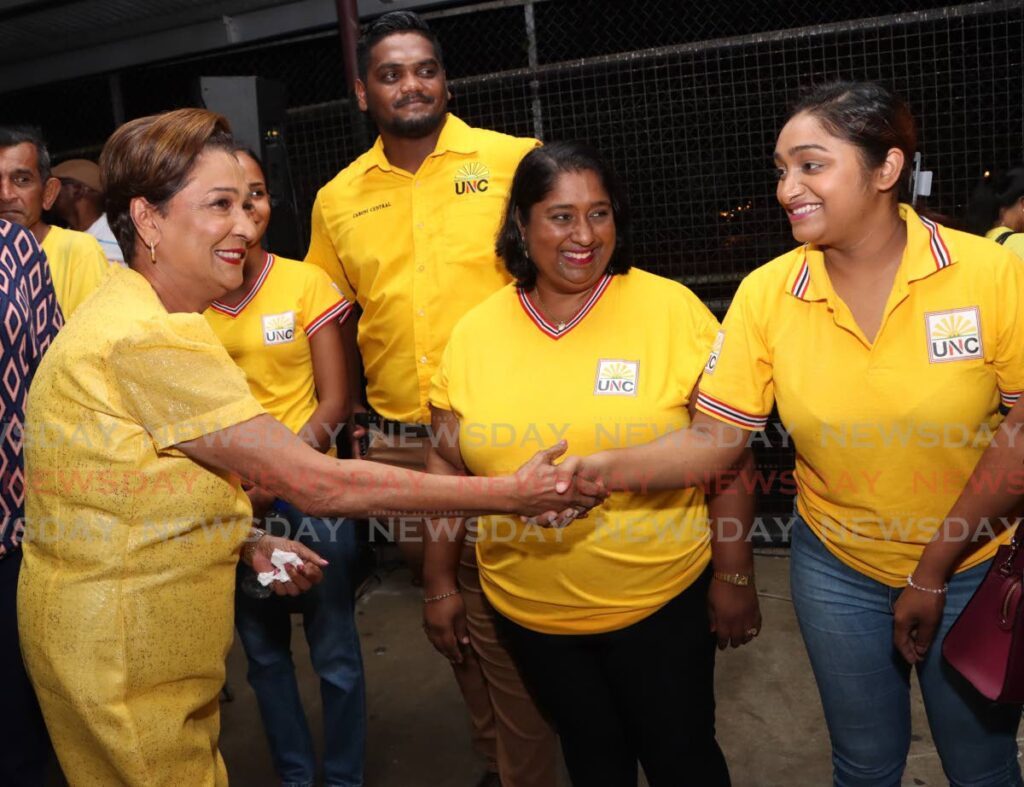 UNC political leader Kamla Persad-Bissessar, greets supporters at a cottage meeting at the Penal Secondary School on May 20. - Photo by Angelo Marcelle
