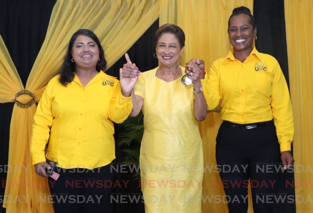 UNC political leader Kamla Persad-Bissessar presented Sarah Sookdeo and Nicole Gopaul as the candidates for Quinam/Morne Diablo and Lengua/Indian Walk, in the upcoming by-election at a cootage meeting at Penal Secondary School on the night of May 20. - Photo by Angelo Marcelle