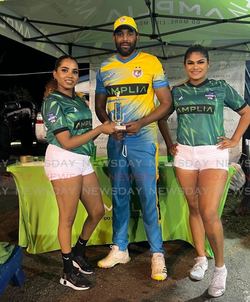 TT Red Force and Central Sports veteran Imran Khan shows off his Man of the Match award following his team’s win against Shivrani All Stars in the Amplia Chaguanas Mayor’s T10 tourney on May 21. Photo courtesy Amplia.  - 