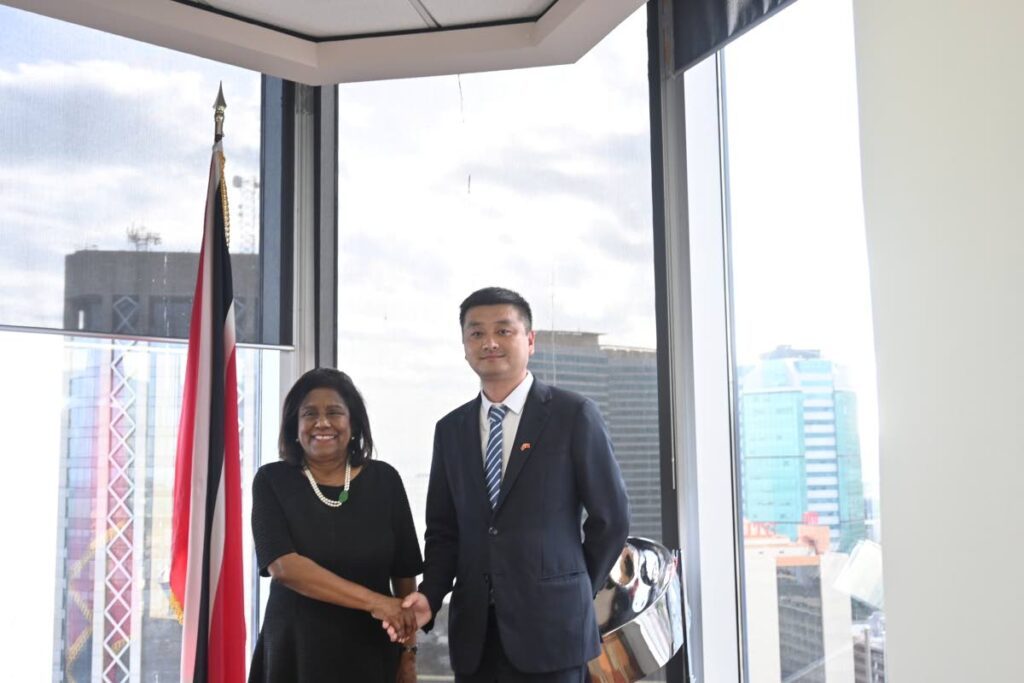 Trade Minister Paula Gopee-Scoon, left, greets China Building Material Market Association VP Ye Liu, at the ministry's headquarters in Port of Spain on May 23. - 