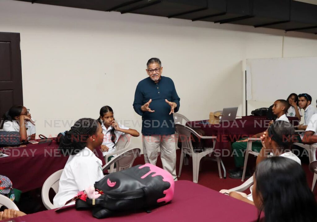 Johnny Coomansingh speaks with students from the Carapichaima East Secondary School at the Divali Nagar in Chaguanas on May 24. - Photo by Ayanna Kinsale