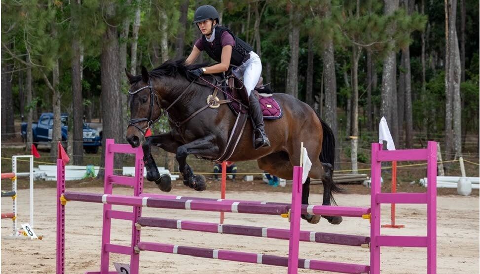 Justynne Serrette-Fletcher and her trusted horse Cape Canaveral competing in the FEI Jumping World Challenge.  - 