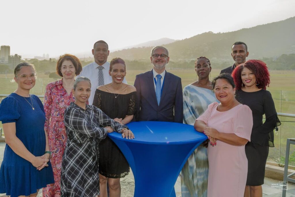 Ambassador Peter Cavendish, centre, surrounded by his staff at the Delegation of the European Union to TT. - 