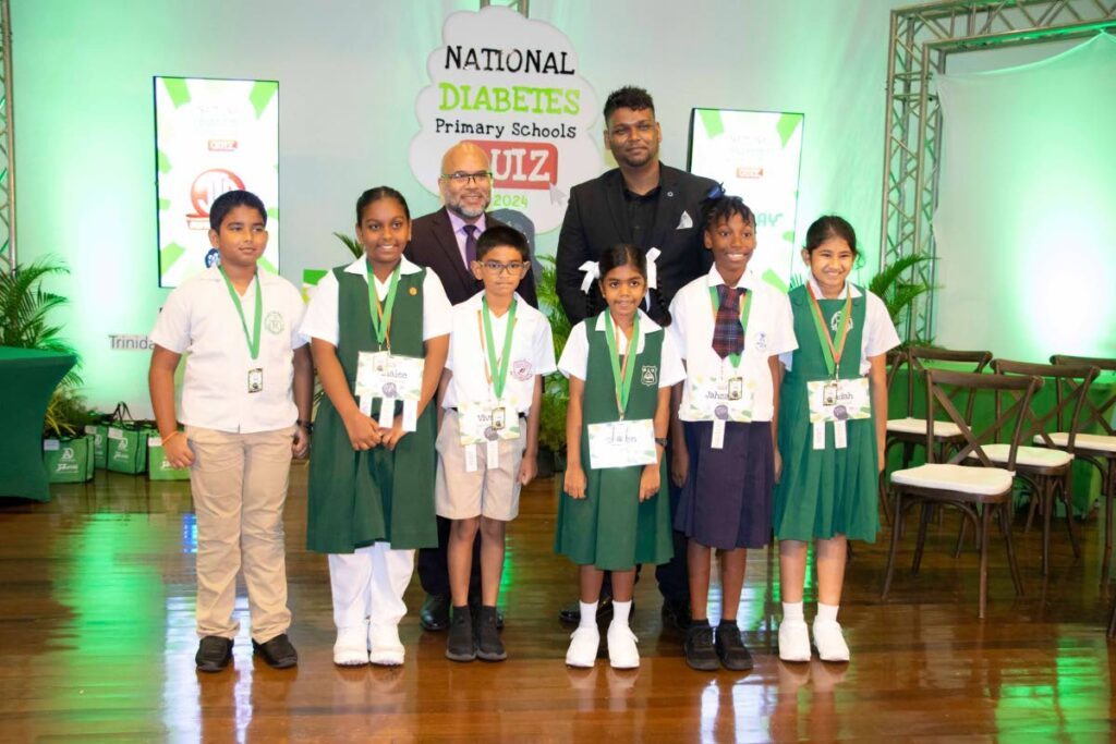  Kerwyn Garcia, SC, and president of the Diabetes Association, 
Dr Andrew Dhanoo with the six finalists in the National 
Diabetes Primary School Quiz. - 