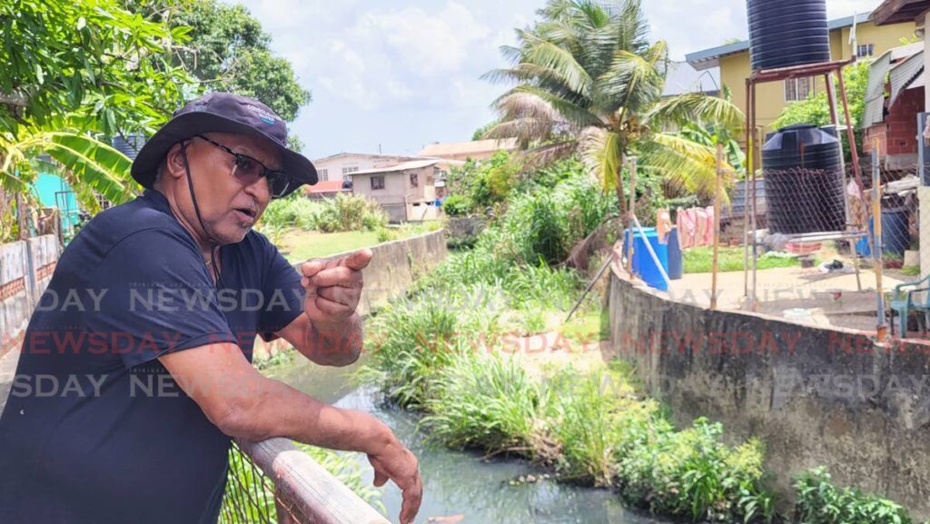 Harrynarine Jerrybandan, 81, says the Ministry of Works and Transport hasn't cleaned the river next to his home in Mootoo Street, Marabella, since 2016. He showed the river to Newsday on May 27 as he raised concerns of flooding ahead of the rainy season and called on the authorities to clean the river before it's too late. - Photo by Venessa Mohammed