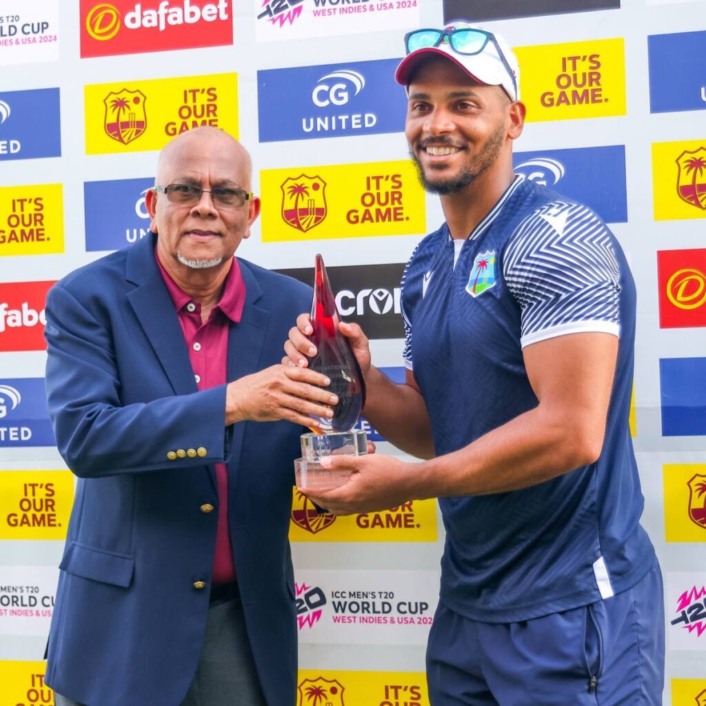 West Indies stand-in captain Brandon King (R) is presented with the series trophy by Cricket West Indies VP Azim Bassarath following the West Indies’ 3-0 T20 series sweep against South Africa, on Sunday at Sabina Park, Jamaica. - CWI Media