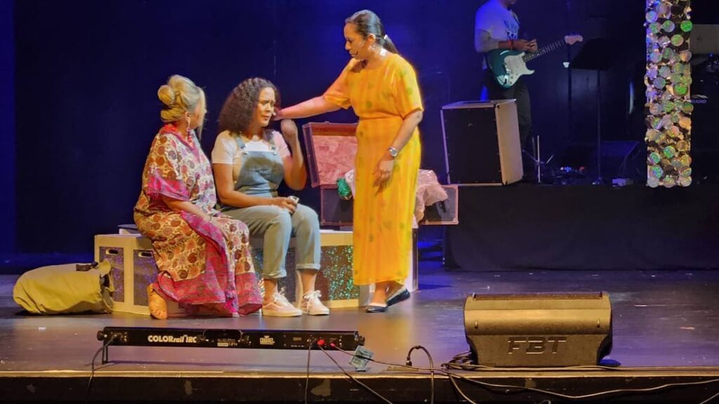 Tanya (Cecilia Salazar), left, comforts and listen to the quagmire Donna (Michelle Tardieu) has found herself, after her daughter Sophie invites three of her ex-lovers, one of whom could be Sophie’s dad, to walk her down the aisle in Mamma Mia!.
 - Yvonne Webb