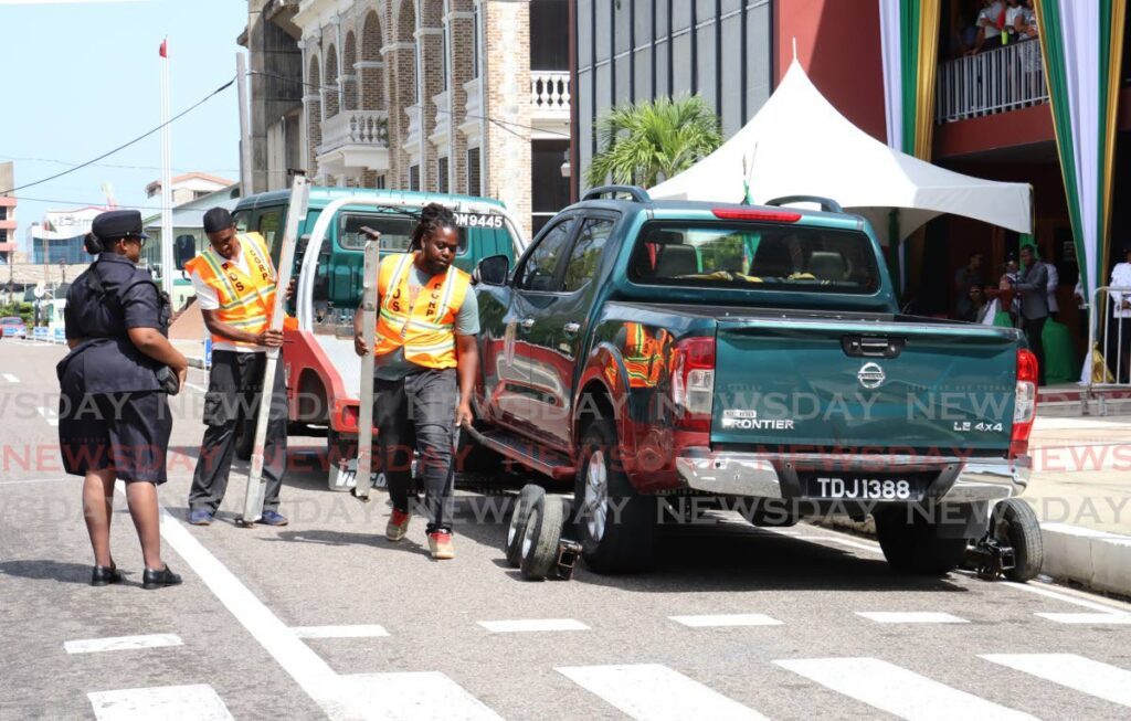 Members of the Port of Spain Municipal Police Unit conduct a towing simulation mayor Alleyne's first mayor’s quarterly inspection parade in front of City Hall, Knox Street, Port of Spain on May 28.