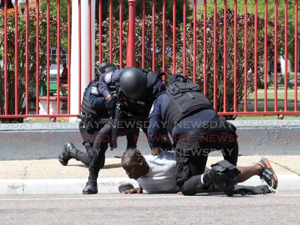 Members of the Port of Spain Municipal Police Unit conduct a tactical display for mayor Alleyne's first mayor’s quarterly inspection parade in front of City Hall, Knox Street, Port of Spain on May 28.