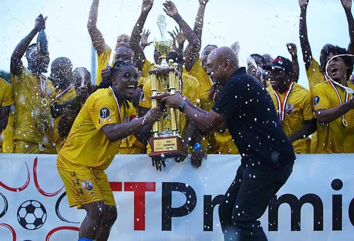 TT Premier Football League (TTPFL) CEO Colin Wharfe (R) presents the 2024 TTPFL trophy to AC PoS skipper Duane Muckette on May 19. Photo courtesy TTPFL.  - 