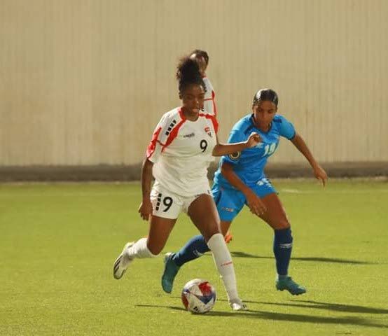 Trinidad and Tobago midfielder and goalscorer Tori Paul (L) takes on an opponent during TT's Caribbean Queen's tournament friendly against Aruba in Curacao on May 29. Photo coutesy TTFA.  - 