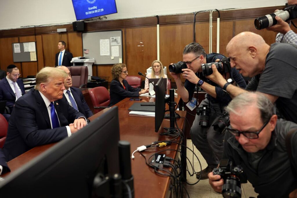 CONVICT: Former US president Donald Trump sits stone-faced while media photographers take his photo inside a Manhattan criminal court on Thursday shortly before he was found guilty on all 34 counts in a 'Hush Money' trial. - AP PHOTO/Michael M. Santiago 