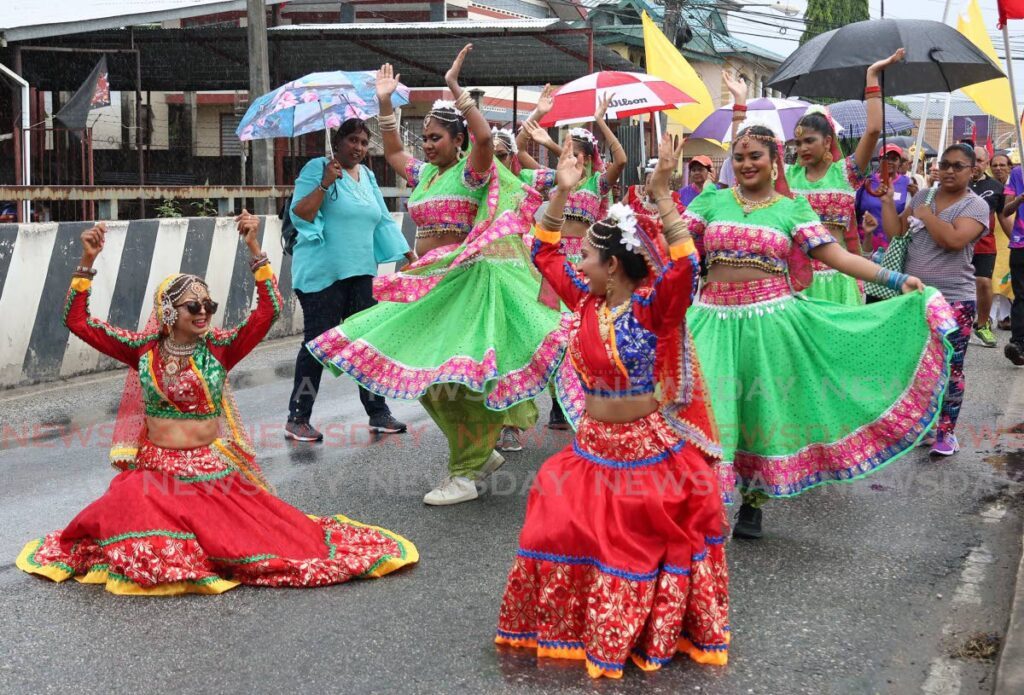 OUR HERITAGE: Dancers in traditional East Indian attire perform during the Maha Sabha's Indial Arrival Day celebration and procession along the SS Erin Main Road in Debe on Thursday. PHOTO BY VENESSA MOHAMMED - 