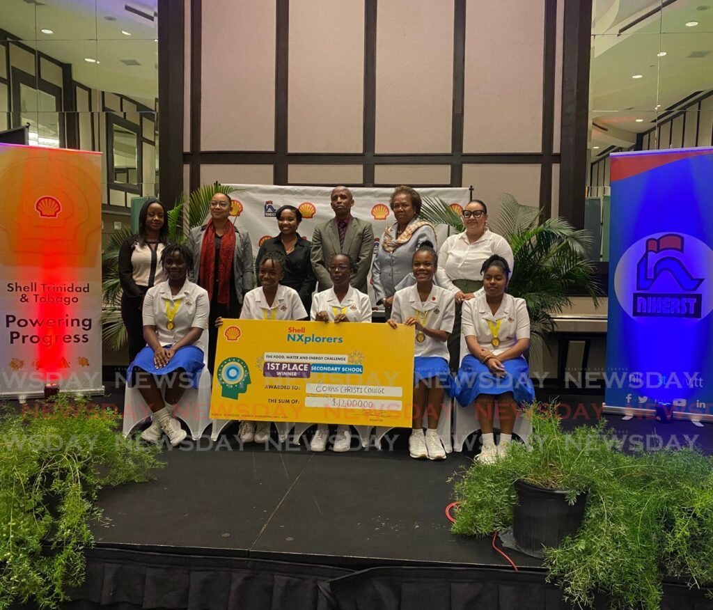 Corpus Christi College students, first place winners of Shell TT's NXplorers programme, pose with officials from Shell TT, Niherst and Ministry of Education at the award ceremony on May 9. - Photo by Sunshine  Arthur