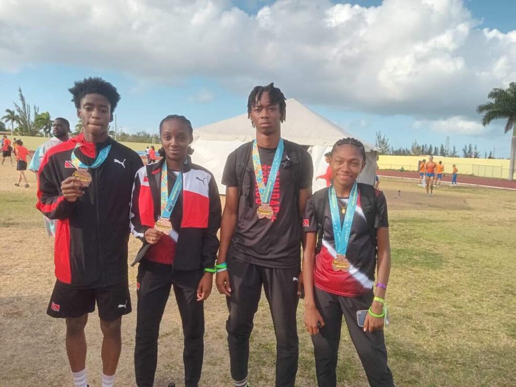 From left, Trinidad and Tobago's Hakeem Chinapoo, Khadija Pickering, Keone John and Kyah Hyson secured bronze during the World Athletics Relay pre-show International Junior Mixed 4x400m, on May 4 in the Bahamas. - Photo courtesy NAAATT