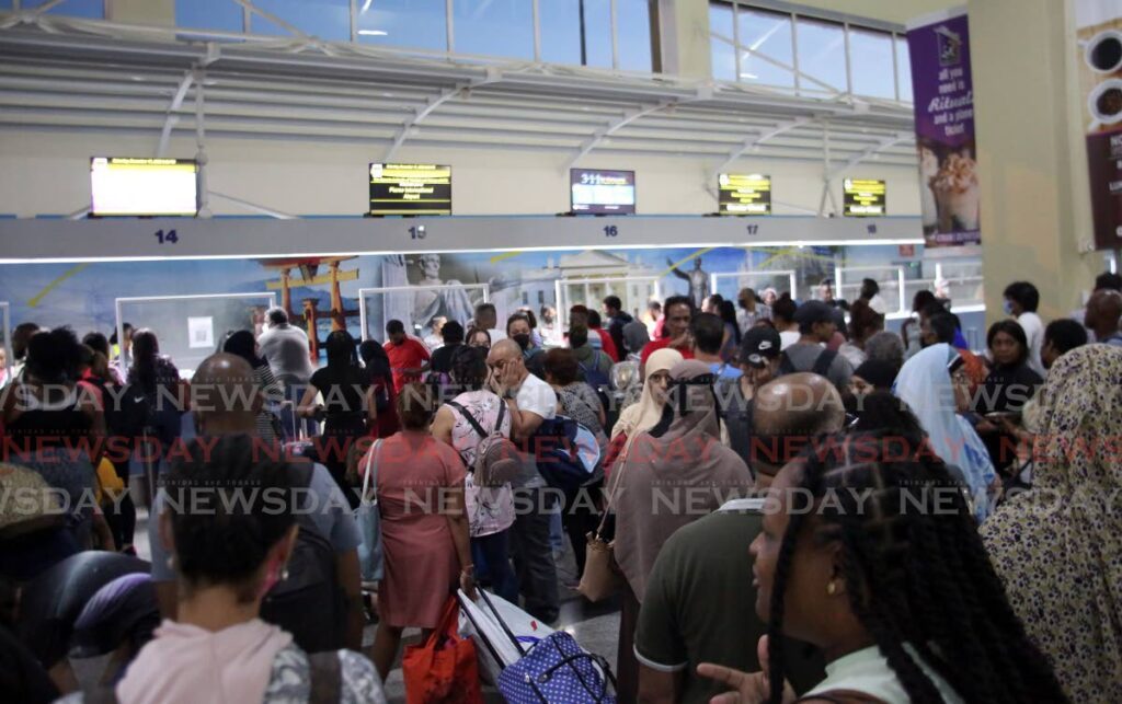 Passengers wait for flights to Tobago at the Piarco International Airport in 2022. The Central Bank's annual economic report says an increase in air and water transportation for 2023 provided growth for the transportation and storage sector.  - FILE PHOTO 