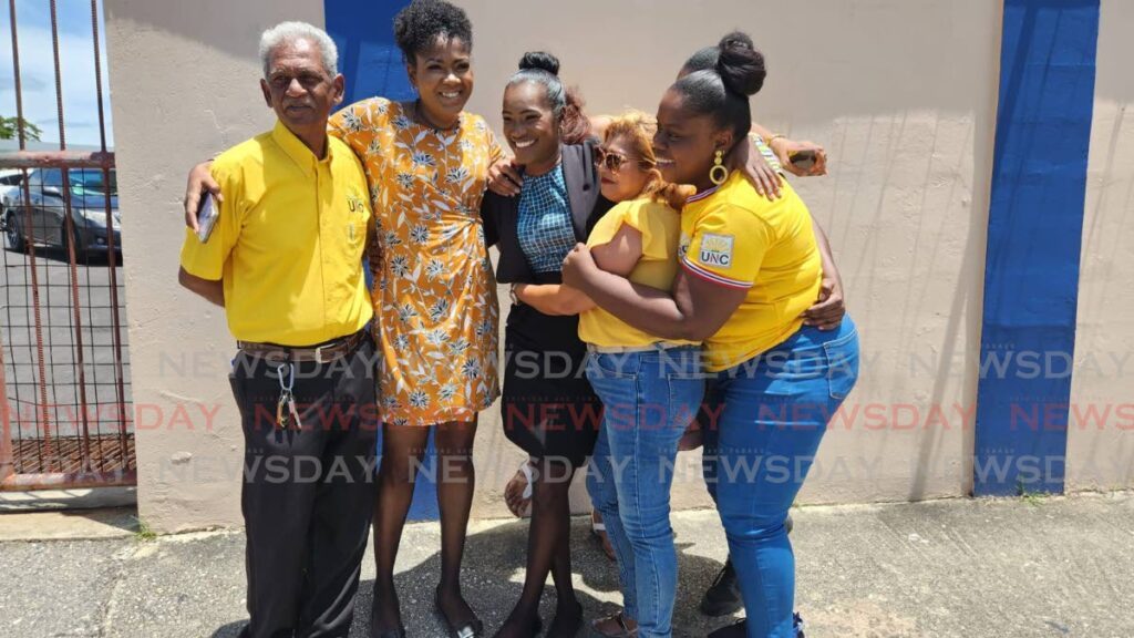 UNC Lengua/Indian Walk candidat Nicole Gopaul, centre, with Moruga MP Michelle Benjamin, second from left, and other UNC supporters after she filed her nomination papers at the Princes Town East Secondary School on May 24. - Photo by Yvonne Webb