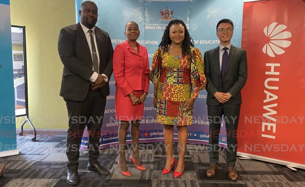 From left Adopt-a-School coordinator Ian Haywood, permanent secretary Ministry of Education Jacquelin Charles, Minister of Education Dr Nyan Gadsby-Dolly and CEO of Huawei TT Ltd Bruce Yu. - Photo by Sunshine  Arthur