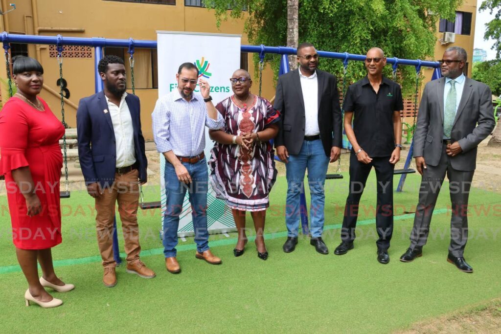 From left: Armdita’s Enterprises Ltd director Leela Phillip, Port of Spain East Councillor Clint Baptiste, Port of Spain North/ St Anns East MP Stuart Young, Housing Minister Camille Robinson-Regis, Port of Spain Mayor Chinua Alleyne, First Citizens Investment Services Ltd general manager Robin Lewis and Femcol general manager Wesley George at the launch of the Harpe Place Play Park on May 29. - Photo by Roger Jacob