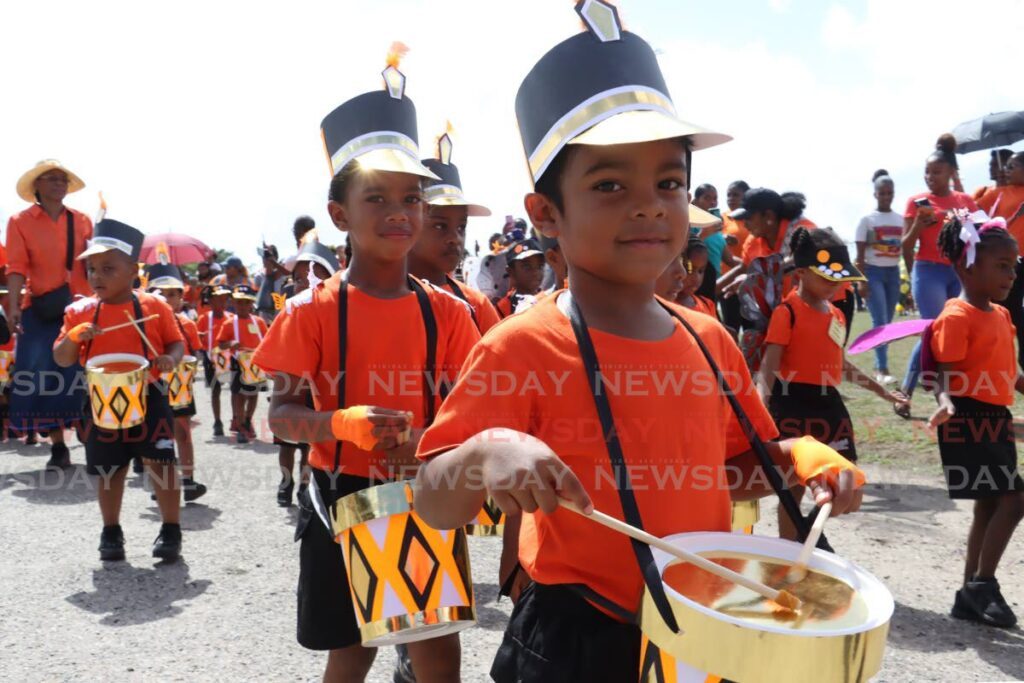 St Augustine South Government ECCE's  group Rhythm of the Monarchs cross the stage for the march pass section of the ECCE District Sports and Family Day. - Photo by Faith Ayoung