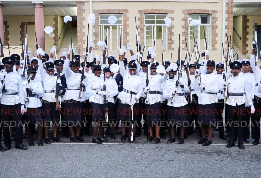 Recruits celebrate during the TTPS passing-out parade at the Police Academy, St James Barracks on May 29. - Photo by Ayanna Kinsale