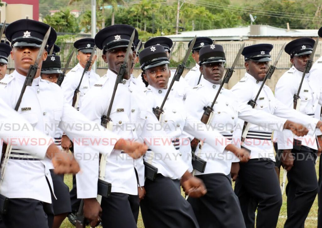 On May 29, police officers who graduated after six months of training during a parade at the Police Academy, in St James. Police recruits undergo polygraph testing as part of the recruitment process. - Photo by Ayanna Kinsale