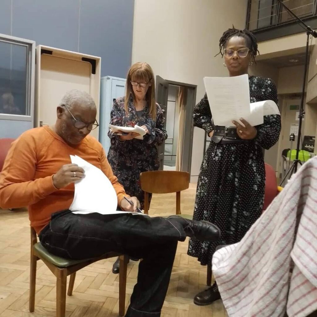 Stars of the BBC World Service British Council International Radio Playwriting Competition 2023 winning play The Mighty Corbeau, Don Warrington, left, and Suzette Llewellyn, right, with the play's director Tracey Neale during a rehearsal at BBC Broadcasting House, London, in November 2023. - 