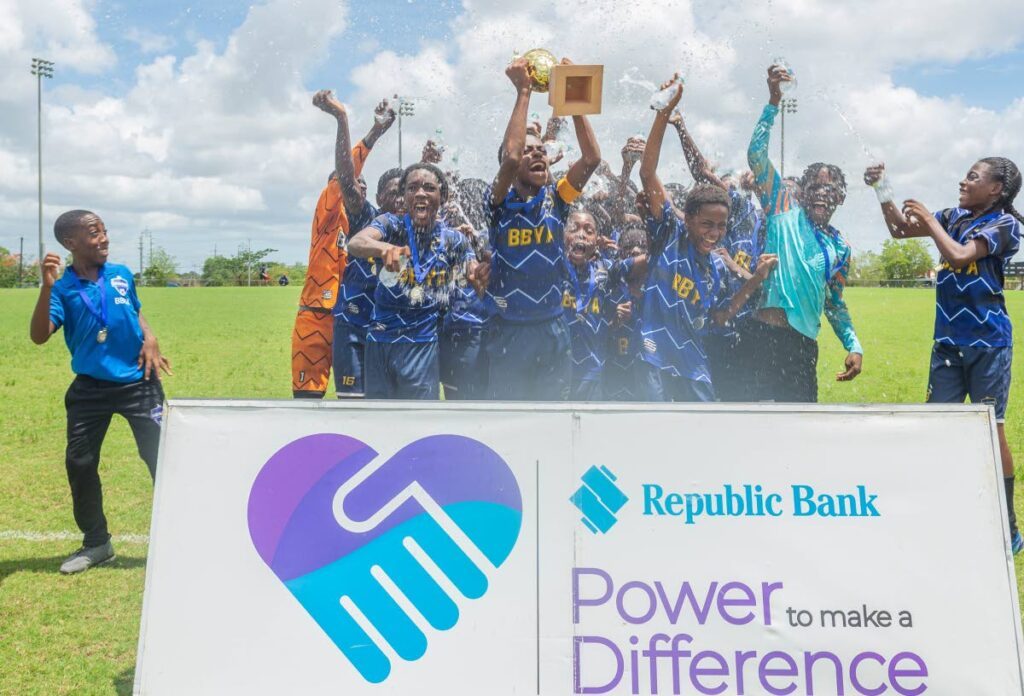 Ball Blasters Youth Academy players celebrate their Republic Cup Youth League boys’ under-14 national final victory over City FC at UTT, O’Meara on June 1.  - 