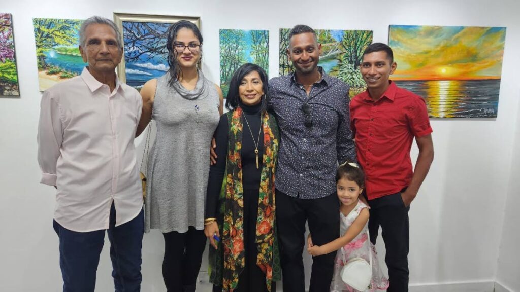 Artist Amina Baksh, centre, with her husband, Doodnath Subnaik, left, daughter-in-law Amara Manickchand Brown, son Jevaughn Brown, his daughter, Emelia Brown, and relative Kriston Lutchman  at an  art exhibition titled Nature's Hands at Arnim's Art Galleria Ltd at Bamboo Bay Road, Gulf View, La Romaine, on June 3. - Photo by Yvonne Webb 