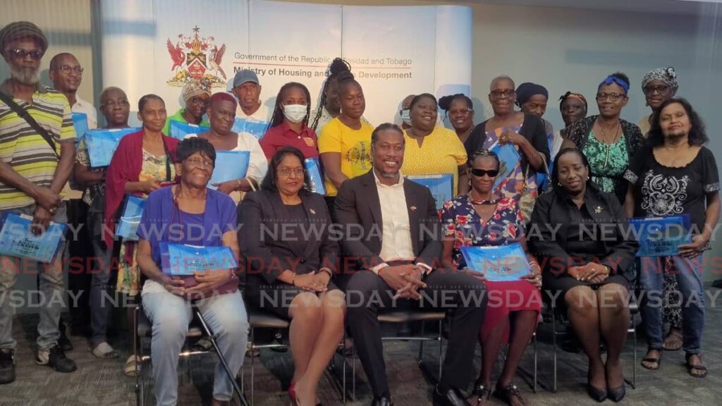 Centre Minister in Ministry of Housing and Urban Development with Hermian Smart-Findlay Manager in Housing Programme Facilitation and Implementation Unit with recipients at the Home Improvement Grant Cheque Distribution Ceremony at Large Conference Room in HDC Port of Spain on June 5.  - Photo by Josette Nicole Deonanan