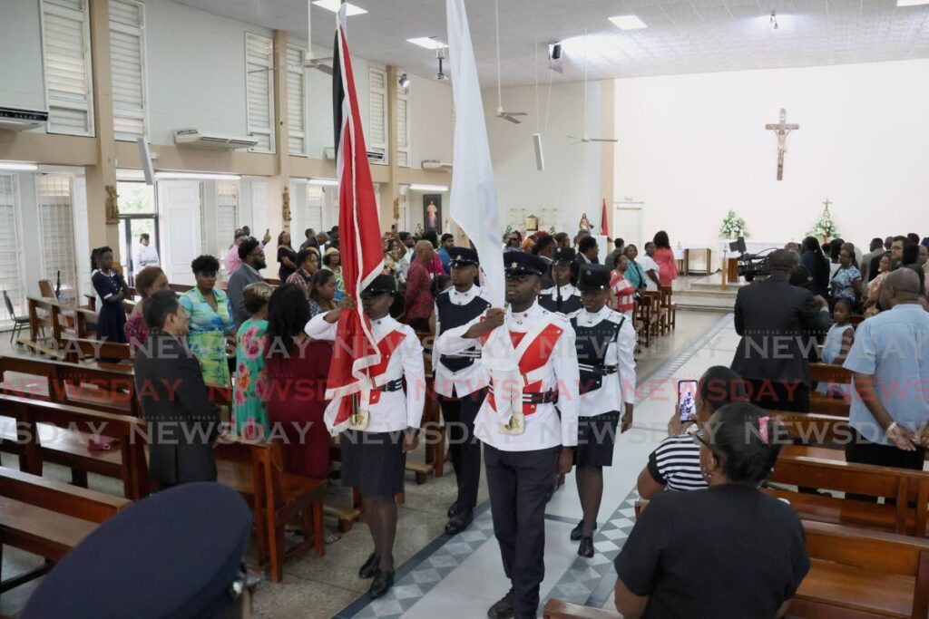 Municipal Police officers perform the Entrance of Colours at the Diego Martin Regional Corporation interfaith service to mark its first anniversary at the Church of the Nativity in Diego Martin on June 8. - Photo by Roger Jacob