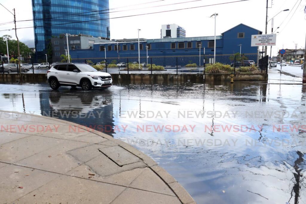 A sudden downpour left streets of Port of Spain flooded on June 4.  - Faith Ayoung