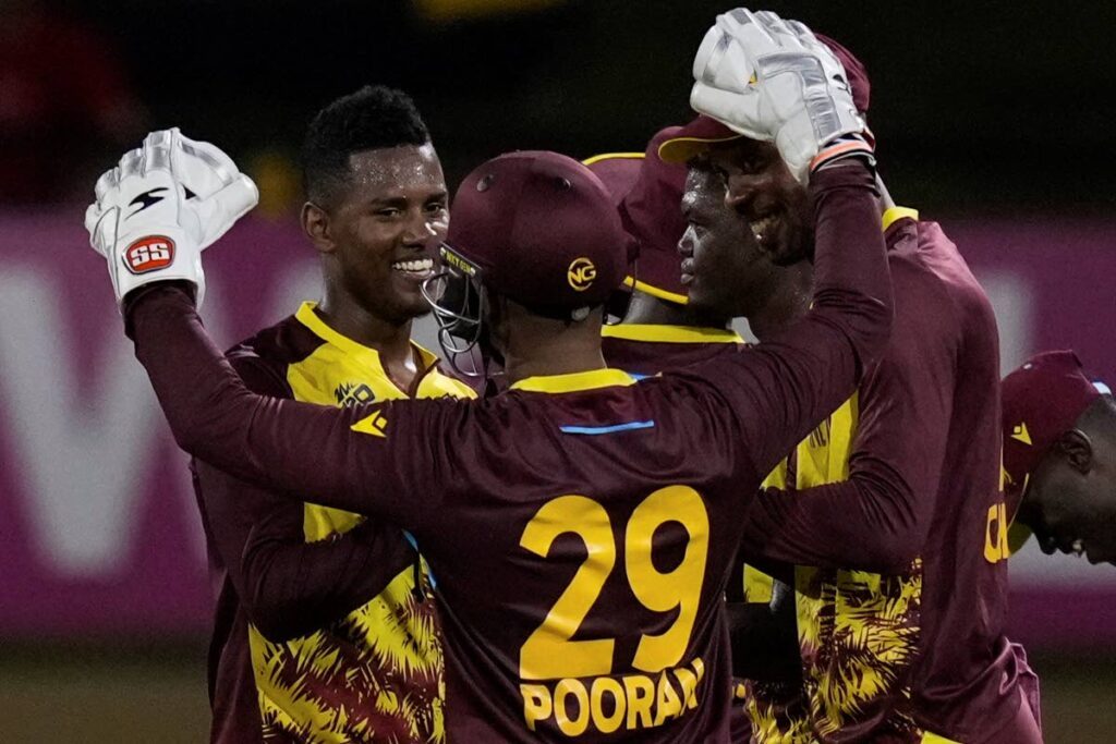 West Indies' Akeal Hosein, left, celebrates with teammates after their 134-run victory over Uganda during an ICC Men's T20 World Cup cricket match at Guyana National Stadium in Providence, Guyana, on June 8, 2024. - AP PHOTO
