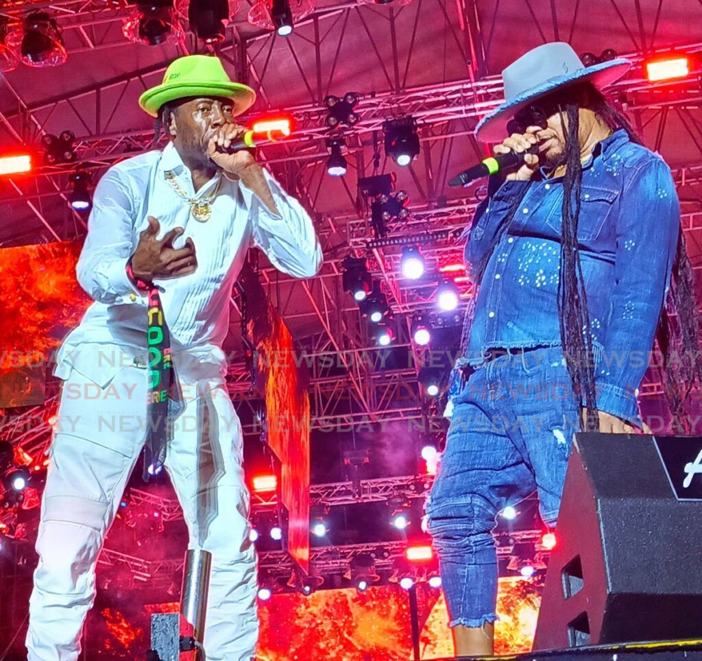 Two-time Grammy-winning artiste and Jamaican dancehall legend Shabba Ranks, left, is joined on stage by England-based Maxi Priest to perform their 1991 collaboration Housecall at the World of Reggae concert at Queen's Park Savannah on June 8. - 