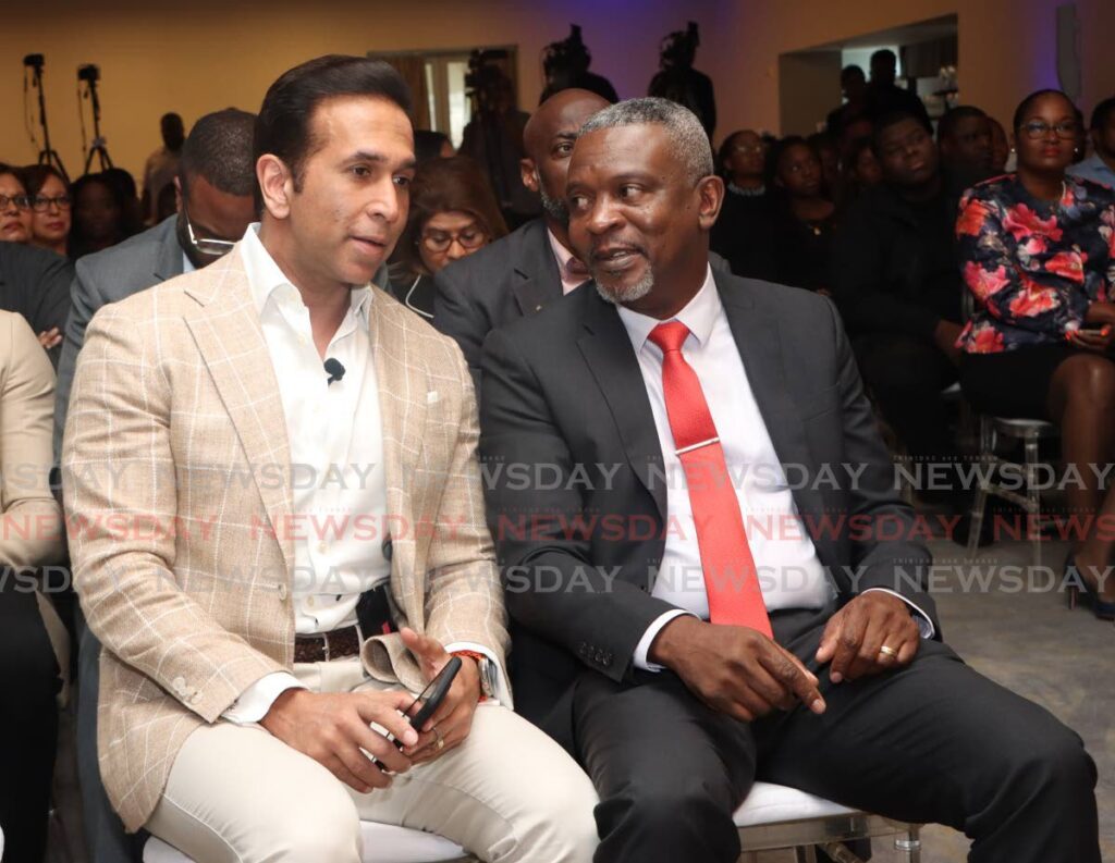 Minister of Rural Development and Local Government Faris Al-Rawi and Minster of Digital Transformation Hassel Bacchus, at the launch of the TT mobile app by the ministry of rural development & local government, at Hyatt Regency, Port of Spain on Wednesday. - Photo by Angelo Marcelle