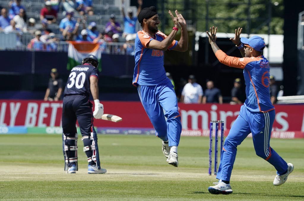 India’s Arshdeep Singh celebrates a successful lbw with teammate India’s Suryakumar Yadav (R) during the ICC men’s Twenty20 World Cup 2024 group A against the USA at Nassau County International Cricket Stadium in East Meadow, New York on Thursday. - AP PHOTO