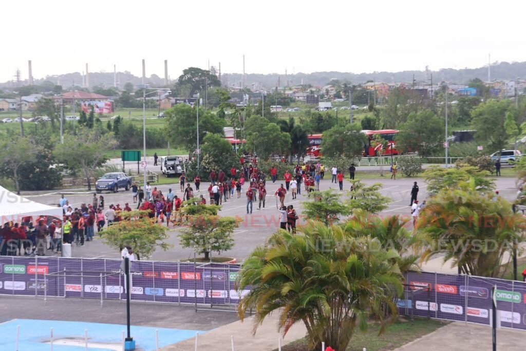 Fans arrive at the Brian Lara Cricket Academy, Tarouba, on shuttles before the ICC Men’s Cricket World Cup match between West Indies and New Zealand on June 12. - Photo by Lincoln Holder