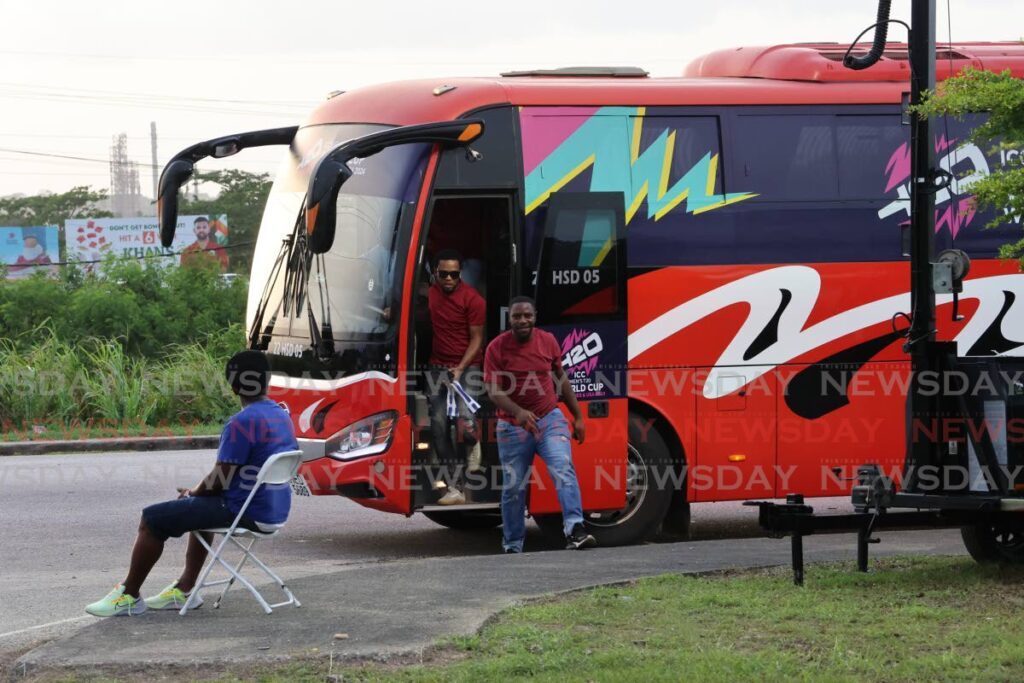 Patrons exit a 'Park & Ride' shuttle at the Brian Lara Cricket Academy, on June 13, ahead of the ICC T20 World Cup match between Afghanistan and Papua New Guinea.  - Photo by Roger Jacob
