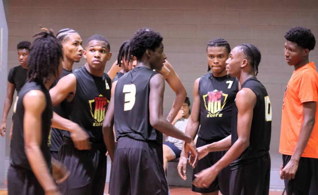Coach KG Elite players talk during a timeout in their Momentum under-23 basketball invitational semifinal versus New Chapter Global Sport Academy at the Maloney Indoor Sport Arena on June 8. - Photo courtesy Momentum basketball